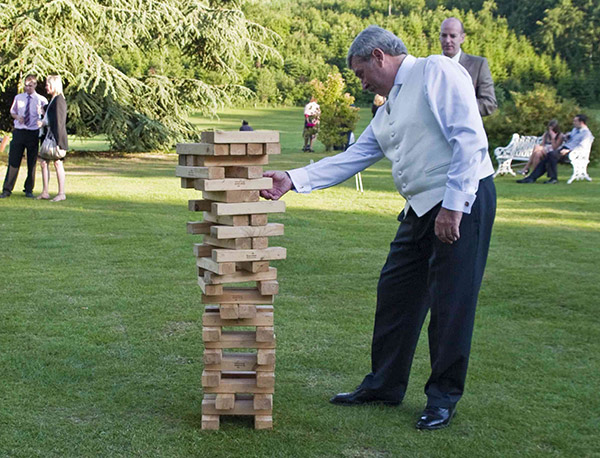 Giant Jenga Carnival Outdoor Game even the groom like to enjoy a little game play.