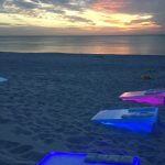 Corn Hole game with LED lights on the beach