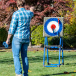 Outdoor interactive safety axe throw game for rent.