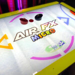Air FX Micro LED Airhockey backlit acrylic playing surface rental from Video Amusement Leasing