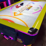 Air FX Mini Airhockey with LED lit legs and perimeter of playfield rental from Video Amusement Leasing