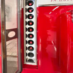 Original Vendo V81 Coca Cola vending machine detail image of bottles available for your event