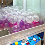 Prize Cube XL 38in claw machine loaded with 4inch capsules rental from Video Amusement Leasing