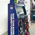 Guitar Hero arcade game with custom branding for convention conference in Las Vegas rental by Video Amusement