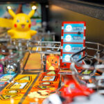 Pikachu and Team Rocket leader in the pinball machine available for hire from Video Amusement San Francisco