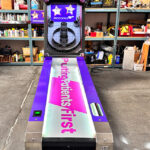 Skeeball arcade game with custom corporate branding for event in Los Angeles by Video Amusement