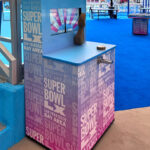 Golden Arm Wrestling arcade game with custom branding at Super Bowl tailgate party in Santa Clara California from Video Amusement San Francisco