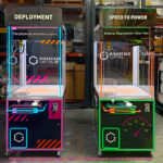 Two Wonder Claw prize crane machine with custom branding and custom overhead backlit signs from Video Amusement
